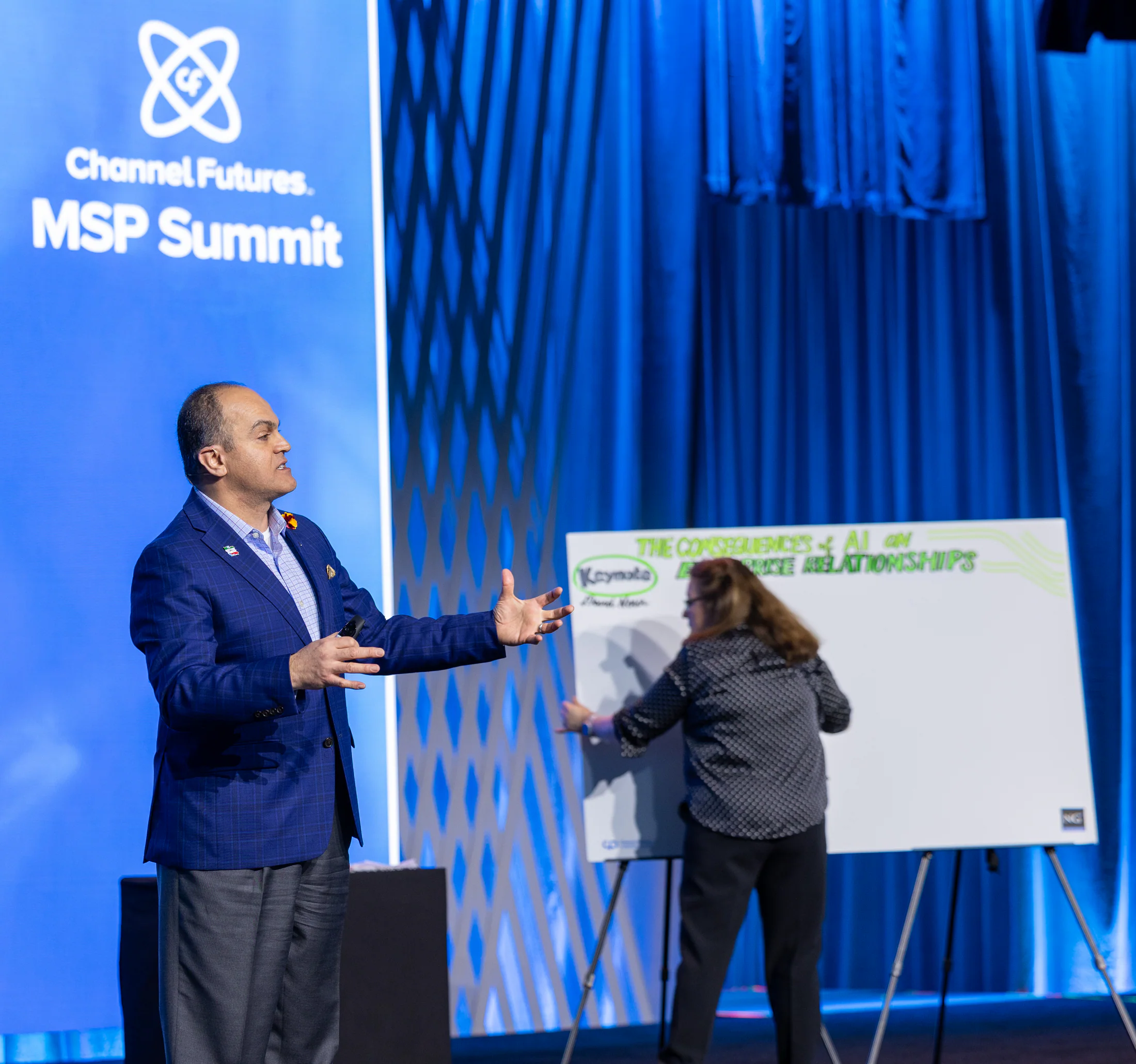 David Nour speaking while a visual strategist captures the room's ideas live